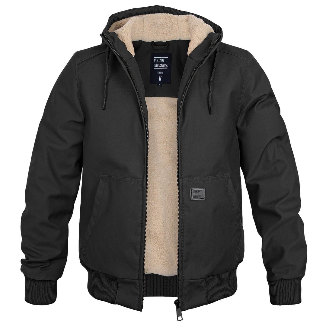 Black Alfie bomber jacket featuring a plush cream sherpa lining, drawstring hood, and durable outer shell for winter warmth.