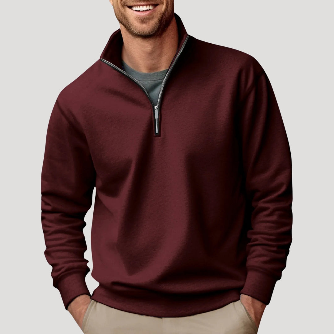 Burgundy men's quarter-zip sweatshirt with a funnel neck, relaxed fit, and soft fabric worn over a grey t-shirt.