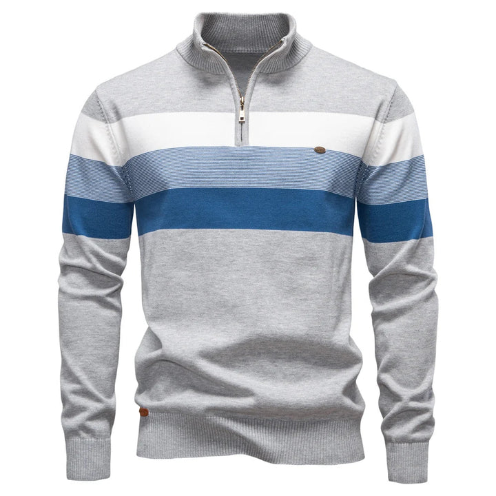 Men's grey quarter-zip jumper featuring white and blue horizontal stripes, ribbed collar, and soft knit fabric.