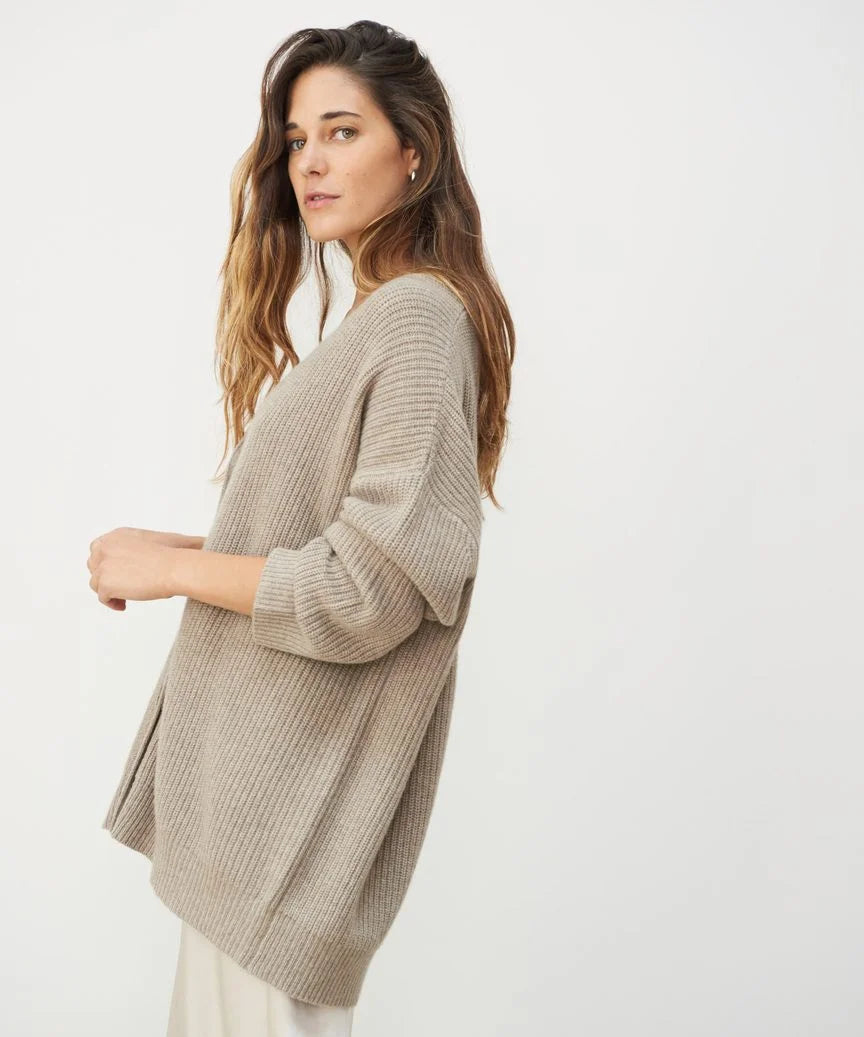 Taupe ribbed oversized V-neck cardigan with dropped shoulders and a soft, brushed knit texture.