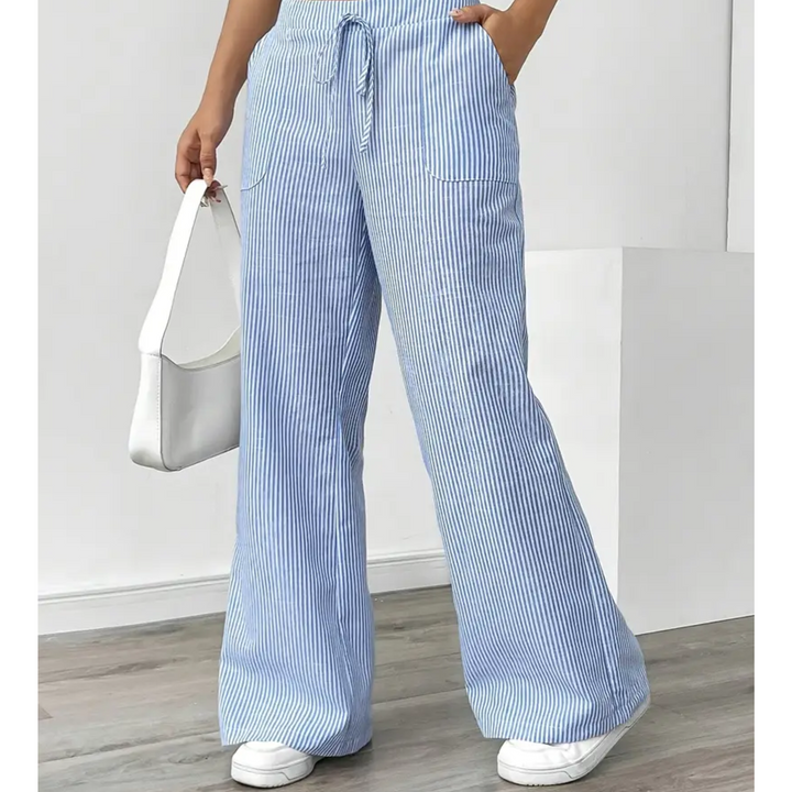 Blue and white striped linen wide-leg trousers featuring an adjustable drawstring waist and side pockets.