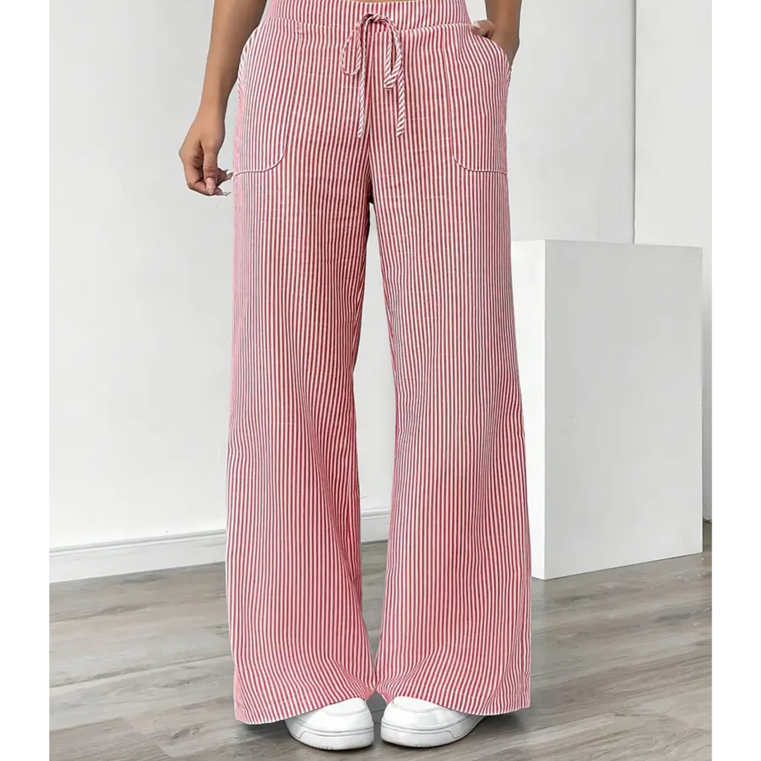 Women's wide-leg linen trousers in red and white vertical stripes with a drawstring waist and front pockets.