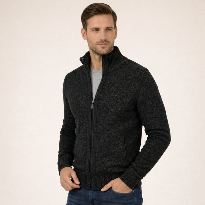 Charcoal marled merino wool full-zip jumper with a ribbed funnel collar and practical side pockets.