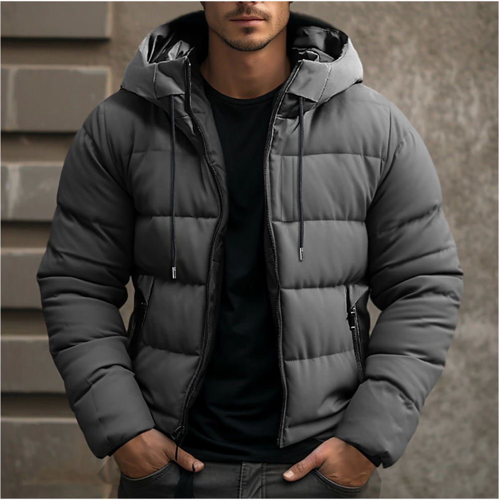 Men's charcoal grey hooded puffer jacket with quilted insulation, full-length zip, and secure side pockets.