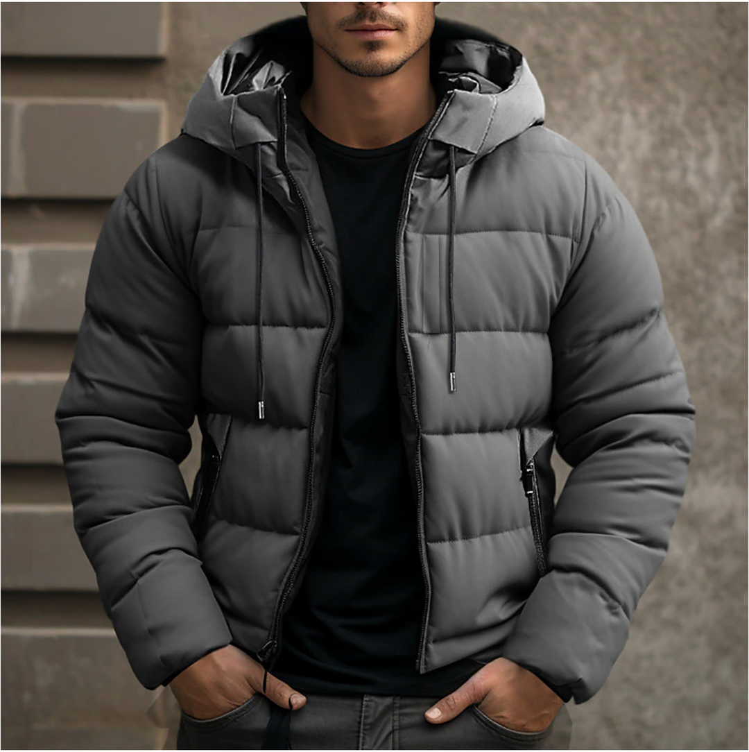 Men's charcoal grey hooded puffer jacket with quilted insulation, full-length zip, and secure side pockets.