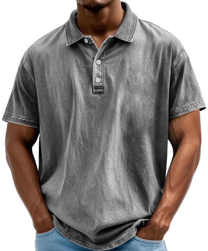Men's grey vintage-washed polo shirt with a classic collar, short sleeves, and a three-button placket.