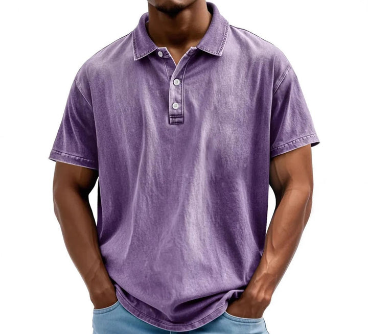 Men's vintage-washed purple polo shirt with a classic collar, two-button placket, and short sleeves.