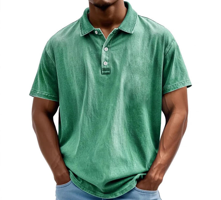 Men's green vintage-washed polo shirt with a classic collar, short sleeves, and a two-button placket.