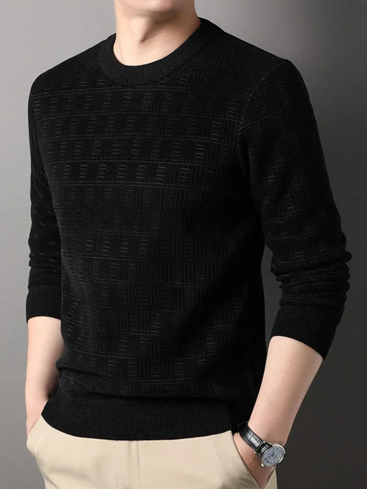 Black crew neck jumper with a subtle textured knit pattern, ribbed cuffs, and hem, styled with beige trousers.