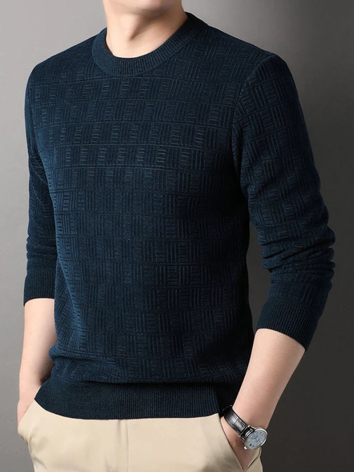Men's navy blue crew neck jumper featuring a refined geometric textured knit, ribbed cuffs, and a classic slim fit.