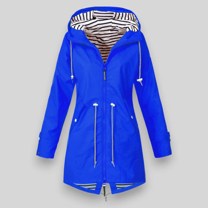 Blue waterproof longline raincoat with an adjustable hood, drawcord waist, and nautical striped interior lining.
