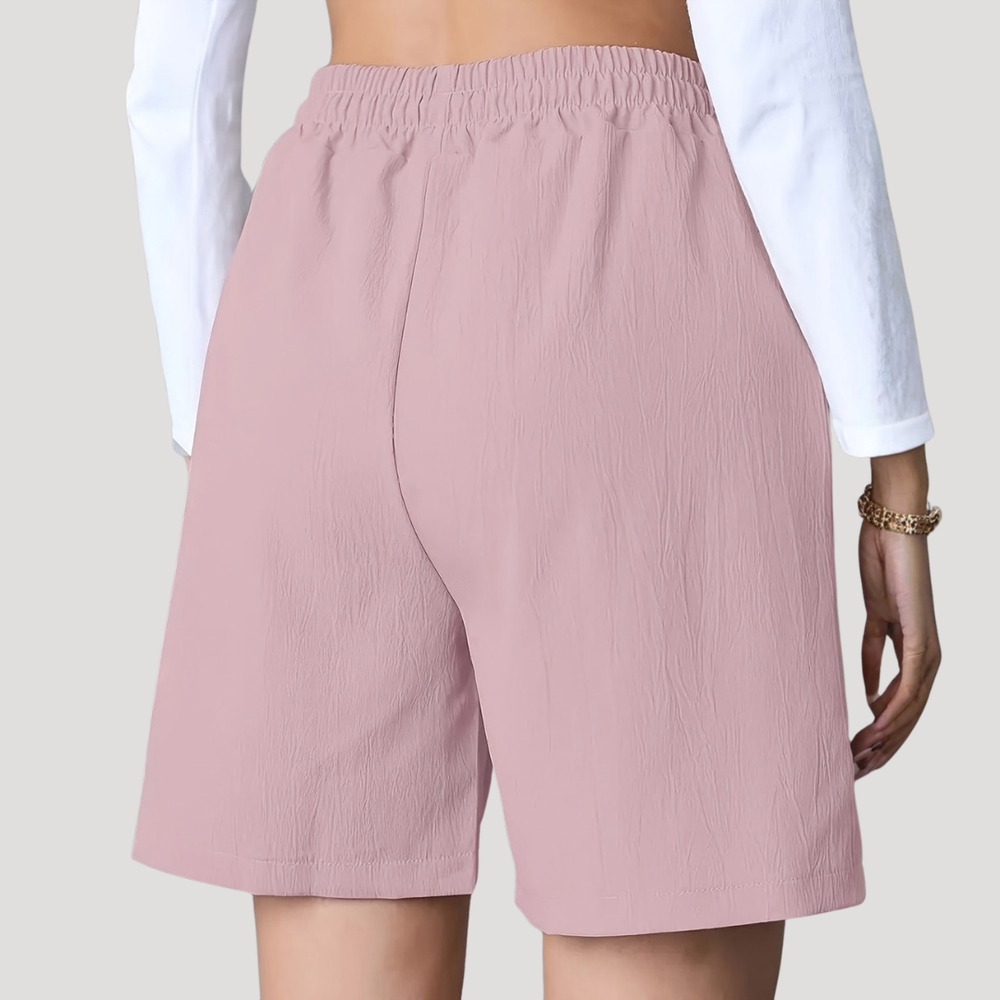 Back view of Bella dusty pink wide-leg shorts featuring a comfortable elasticated waistband and relaxed fit.