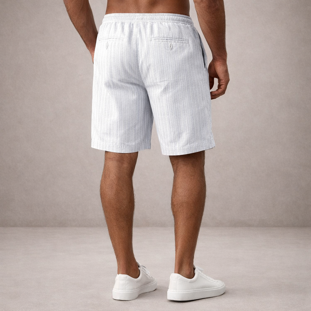Back view of men wearing light blue pinstriped linen drawstring shorts with rear pockets and a clean straight hem.