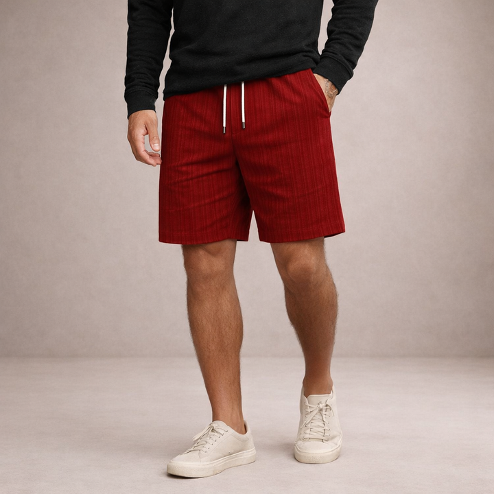 Men wearing red linen-look drawstring shorts with a relaxed fit, side pockets, and a clean straight hem.
