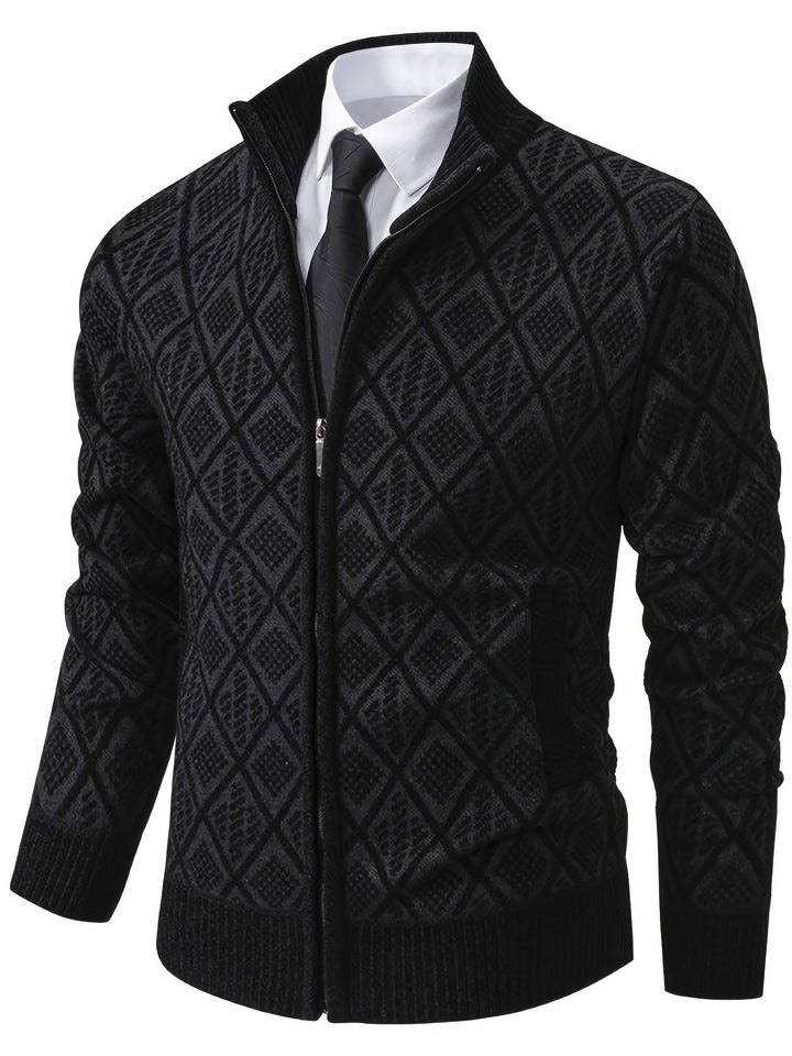 Black geometric knit zip-up cardigan with a stand collar, ribbed cuffs, and hem worn over a white shirt and black tie.