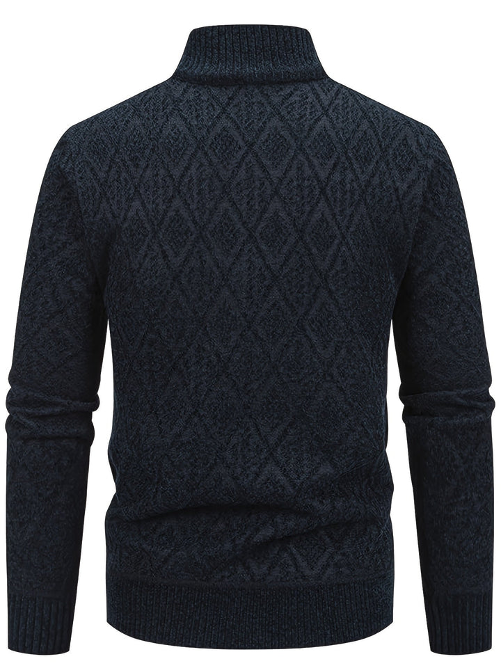 Back view of a navy blue men's zip-up cardigan featuring a textured diamond knit pattern and a ribbed stand collar.