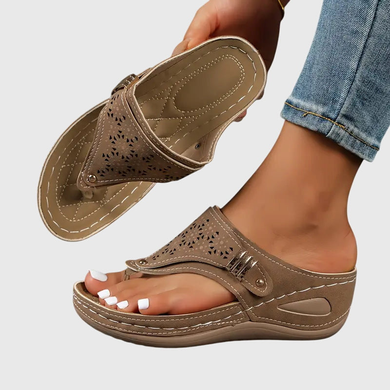 Bonnie women's orthopedic wedge sandals in a warm taupe, featuring a perforated strap, gold-tone buckle, and supportive footbed.