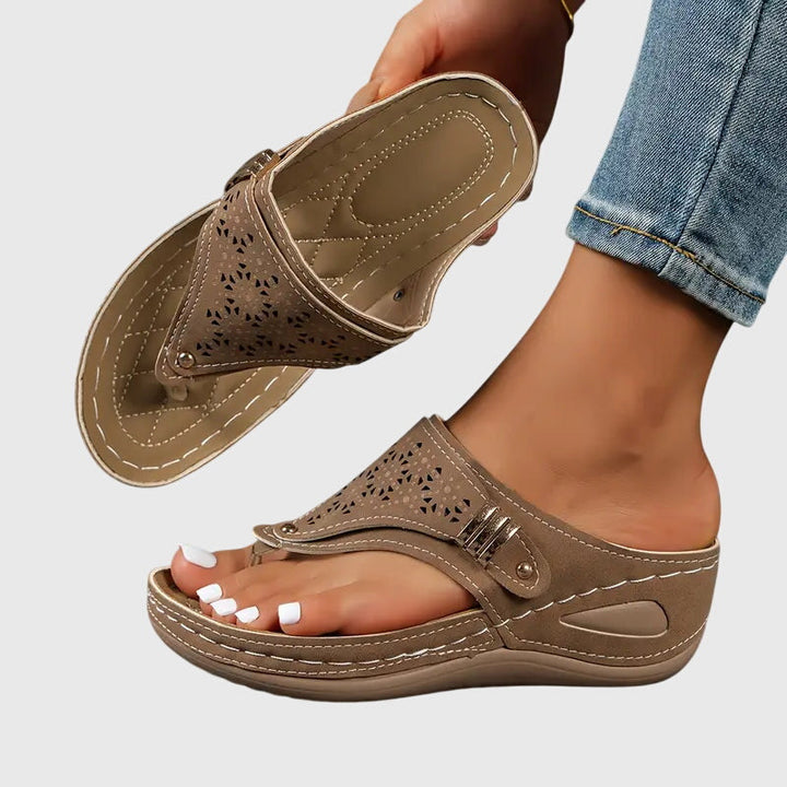 Bonnie women's orthopedic wedge sandals in a warm taupe, featuring a perforated strap, gold-tone buckle, and supportive footbed.