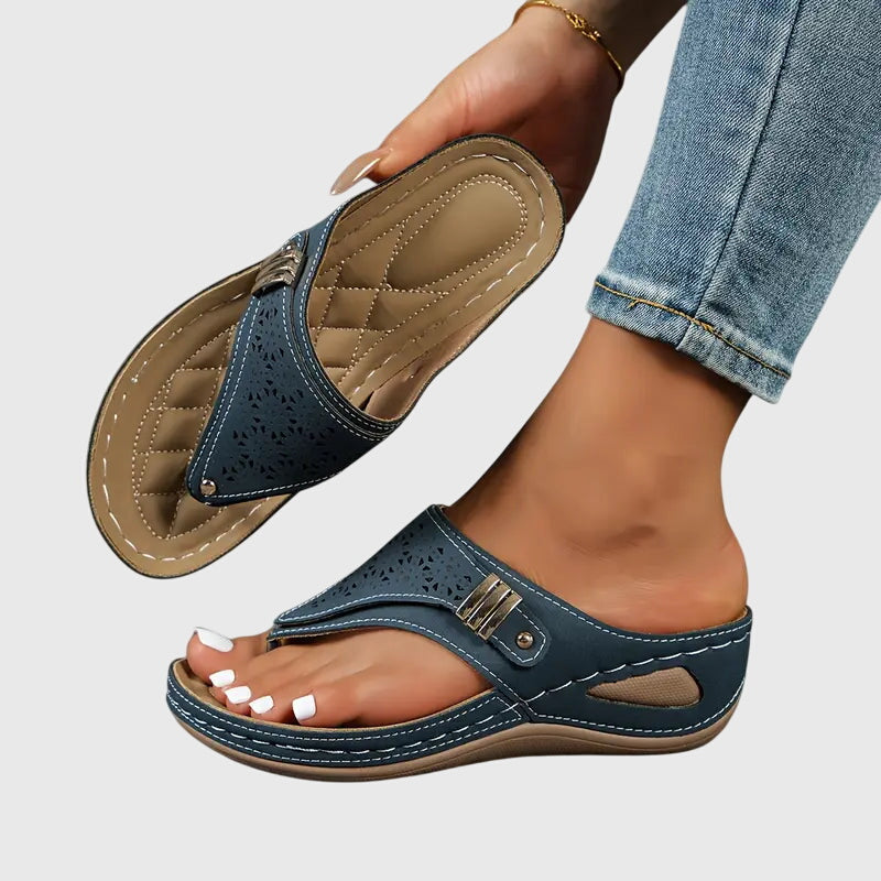 Bonnie women's navy orthopedic wedge sandals with laser-cut details, supportive footbed, and stable sole.