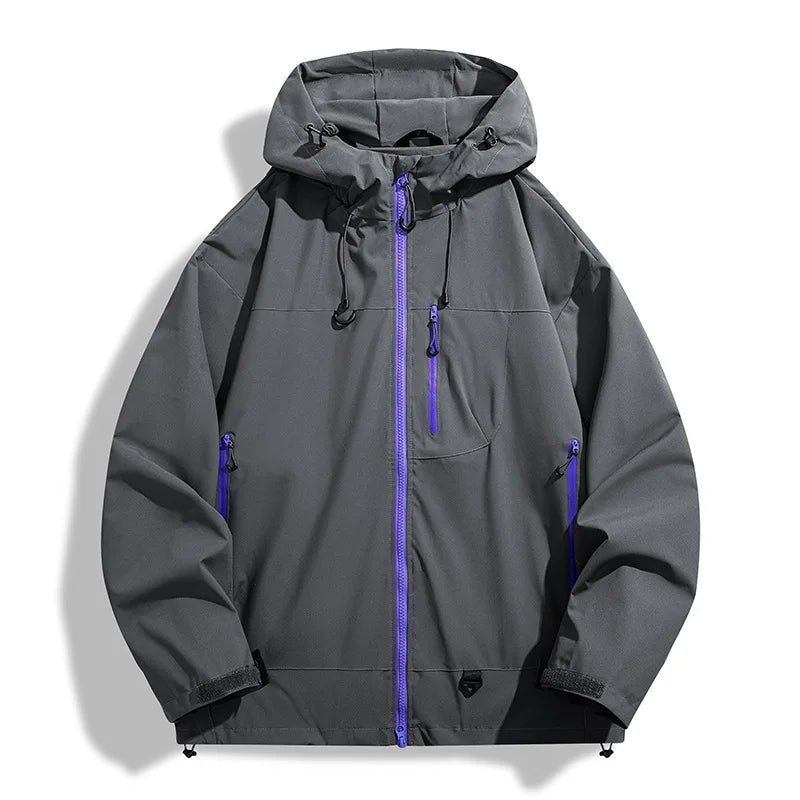 Charcoal grey lightweight windbreaker jacket with a protective hood, adjustable cuffs, and vibrant purple zipper accents.