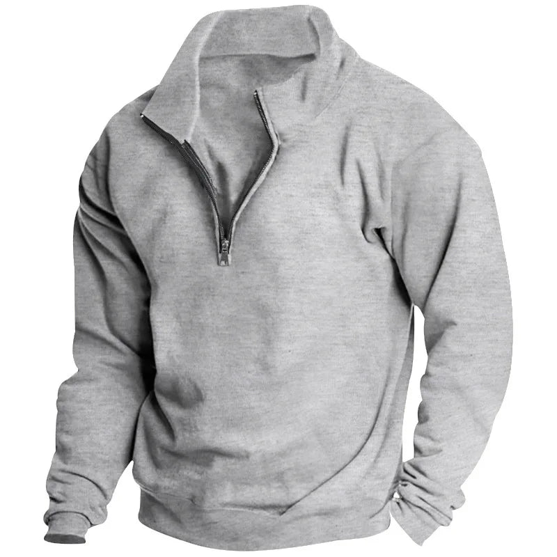 Men's grey quarter-zip sweatshirt in soft fabric with a relaxed fit, ribbed cuffs, and hem for a comfortable, casual look.