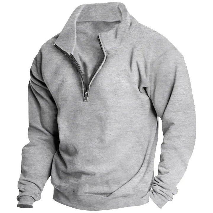 Men's grey quarter-zip sweatshirt in soft fabric with a relaxed fit, ribbed cuffs, and hem for a comfortable, casual look.
