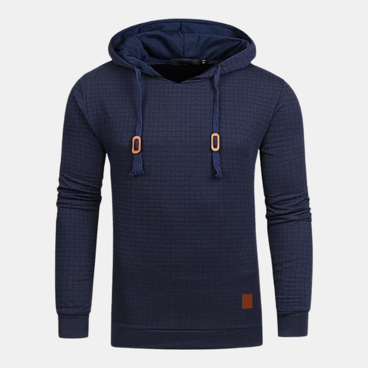 Navy blue men's textured waffle-knit hoodie with an adjustable hood, brown accents, and ribbed cuffs.