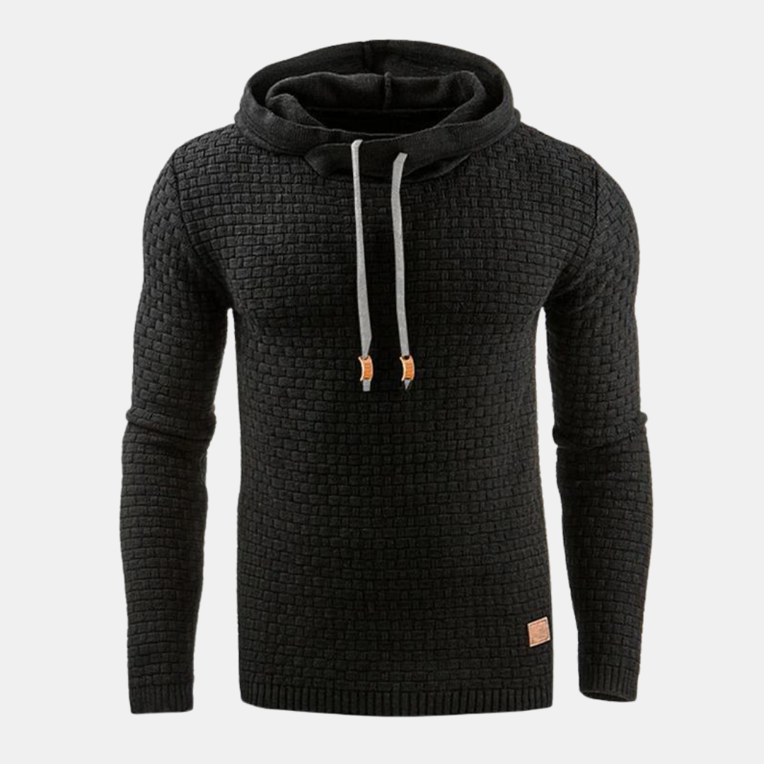 Black men's textured waffle-knit hoodie with an attached hood, grey drawcords, and ribbed cuffs.