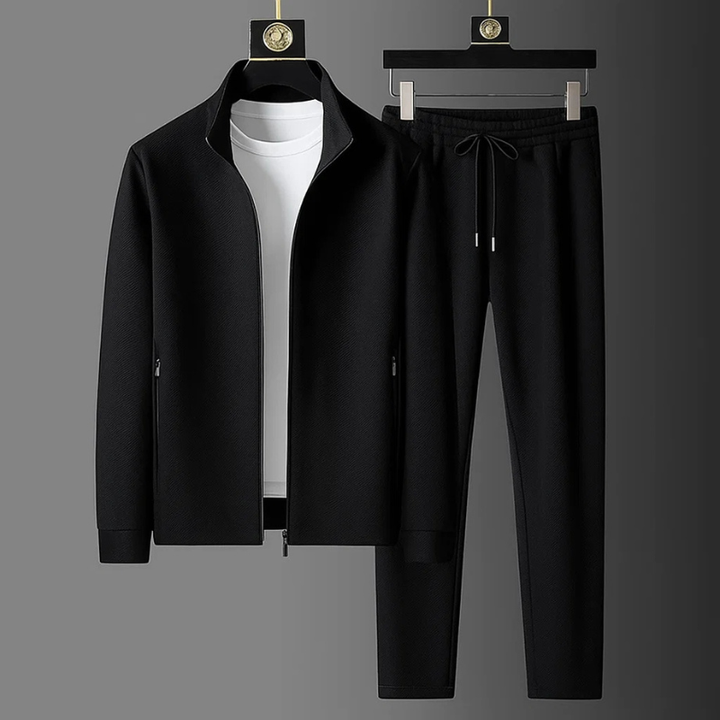 Black textured men's tracksuit set with a funnel-neck zip-up jacket and matching drawstring trousers.
