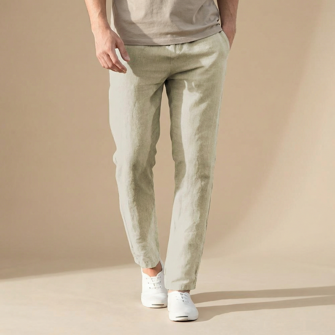 Lightweight sage green linen trousers with a straight-leg fit, side pockets, and an ankle-length hem.