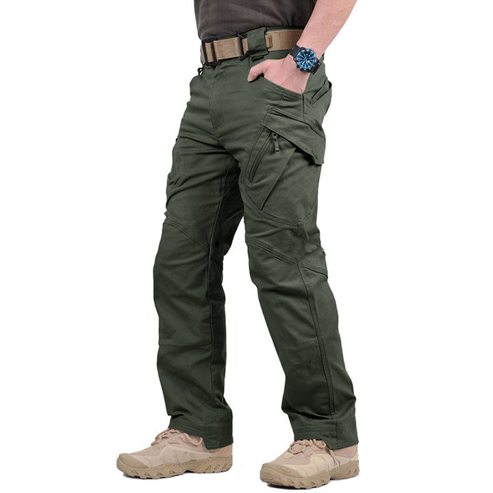 Olive green tactical cargo trousers with reinforced knees, multiple utility pockets, and a durable fit for outdoor wear.