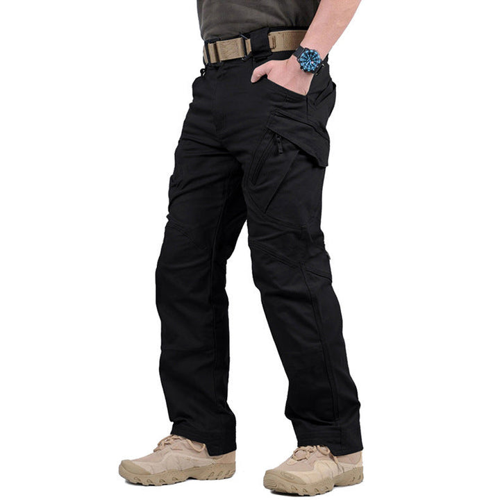 Black tactical cargo trousers featuring reinforced knees, multiple zip pockets, and a durable fit for outdoor activities.