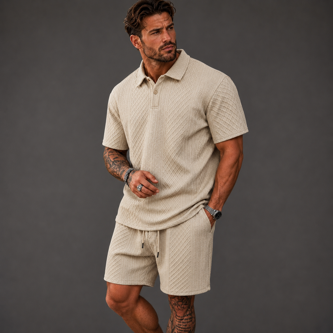 Man wearing a beige textured knit polo shirt and matching drawstring shorts with a relaxed summer fit.