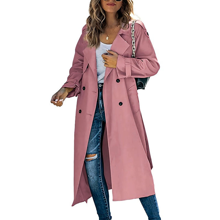 Dusty pink double-breasted trench coat with notched lapels and a flattering long-line silhouette for effortless layering.