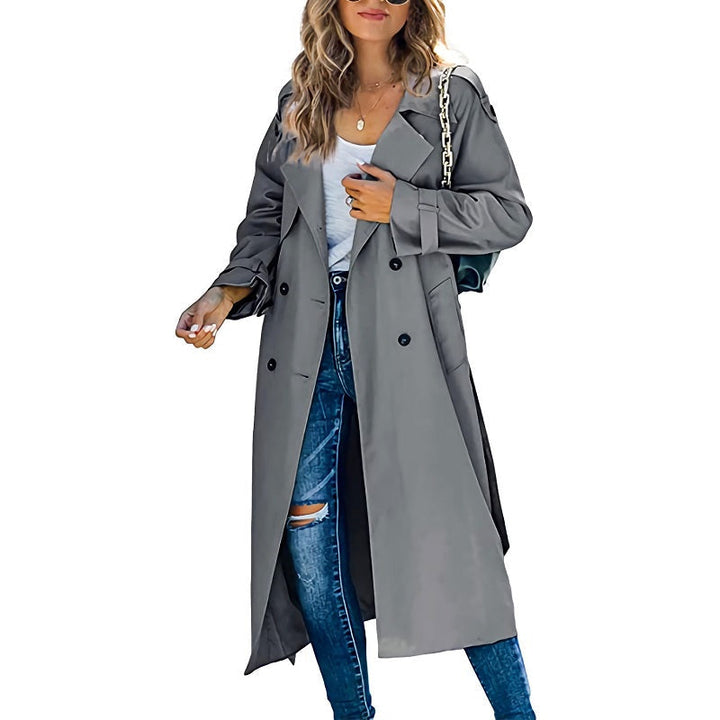 Elegant grey double-breasted long trench coat with notched lapels, perfect for effortless mid-season layering.