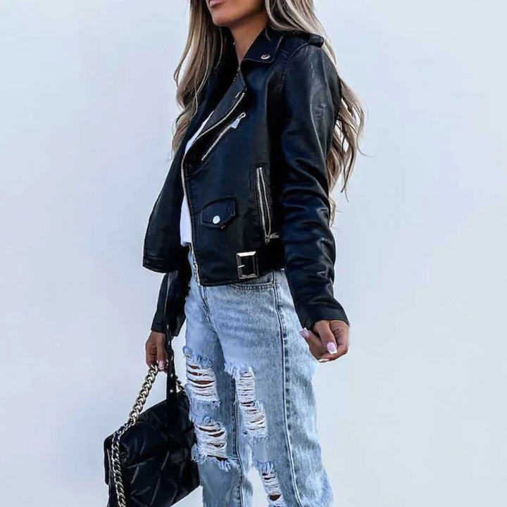 Black cropped faux leather biker jacket with asymmetric zip, notched lapels, and adjustable waist belt.