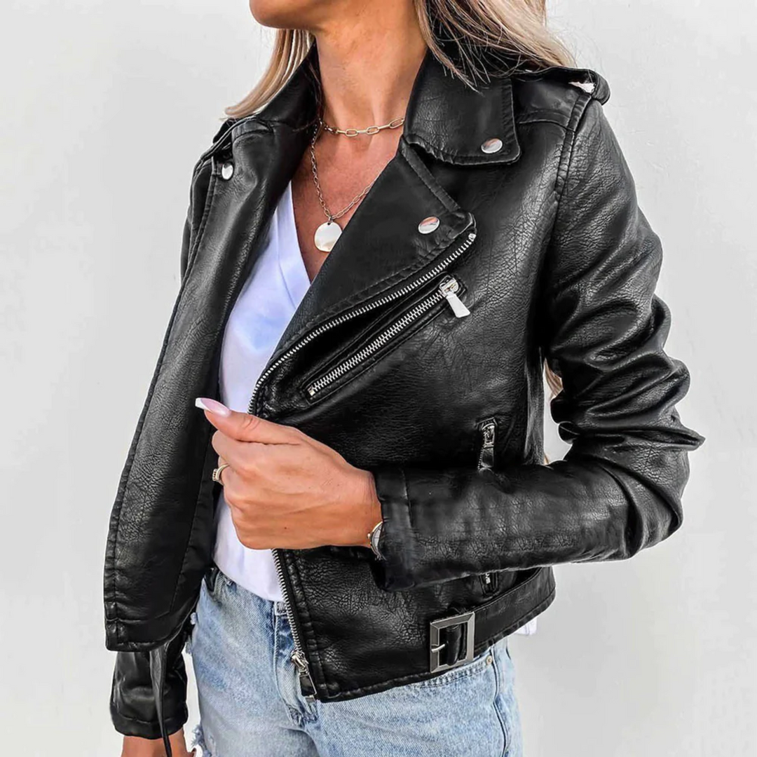 Black faux leather biker jacket with asymmetric zip, notched lapels, silver hardware, and an adjustable waist belt.