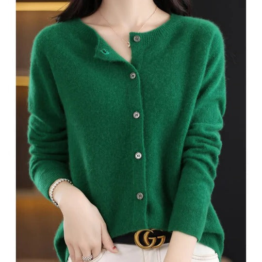 Emerald green round-neck cardigan in soft fine knit with a polished button-up front and ribbed long sleeves.