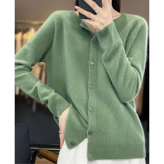 Sage green round neck cardigan in a soft, fine knit with a polished button-up front and ribbed cuffs for effortless layering.
