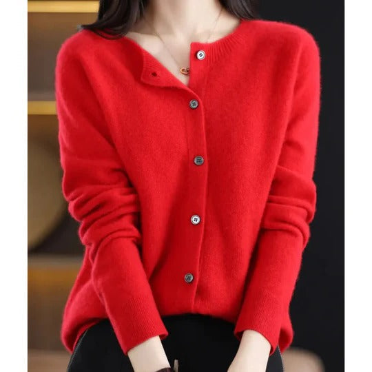 Vibrant red round-neck cardigan in a soft fine knit with a neat front button closure and ribbed cuffs.