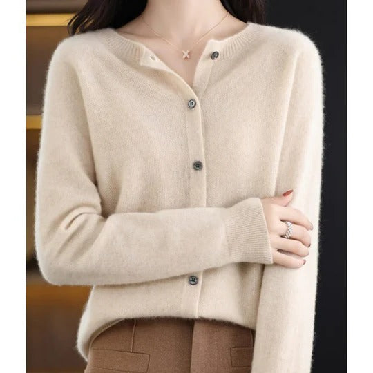 Cream-colored fine knit cardigan with a round neckline, long sleeves, and a polished front button-up closure.