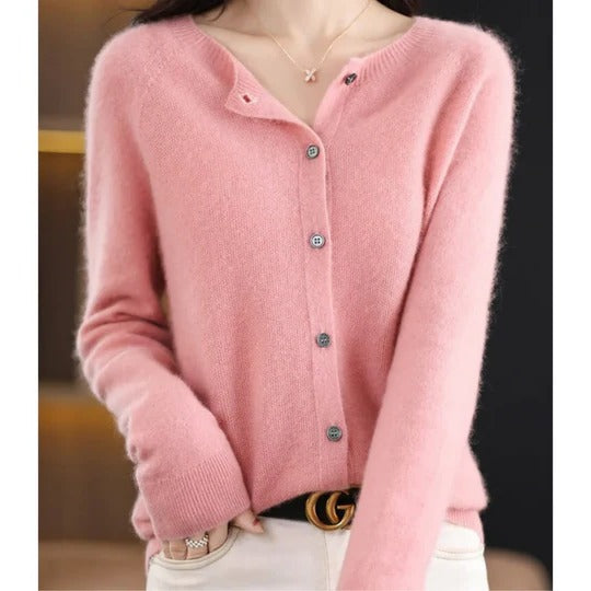 Soft pink Charlotte cardigan featuring a round neckline, fine knit texture, and a polished front button-up closure.