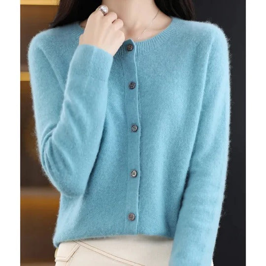 Soft light blue round neck cardigan in a fine, cosy knit with a classic front button-up closure and ribbed cuffs.