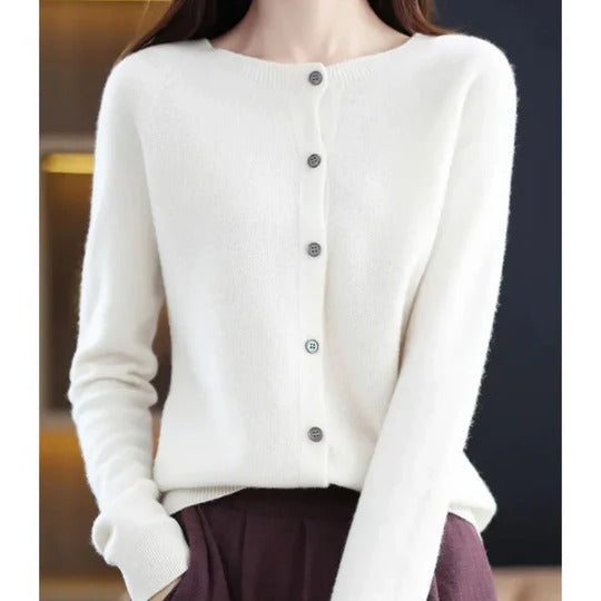 Soft white fine-knit cardigan featuring a classic round neckline and elegant front button-up closure.