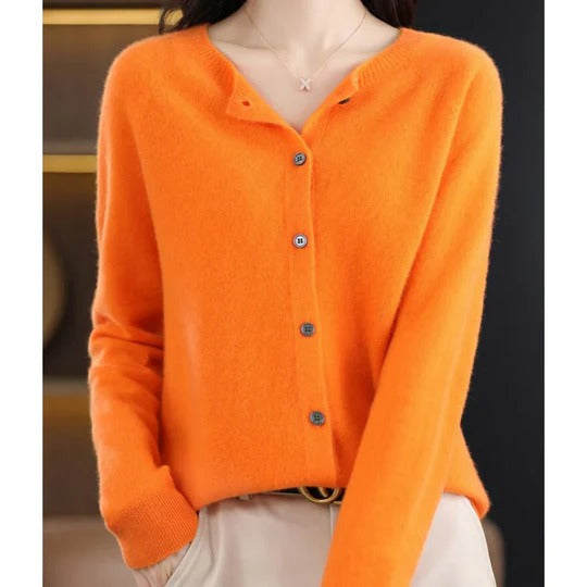 Vibrant orange round-neck cardigan in a soft, fine knit with a polished button-up front and ribbed cuffs.