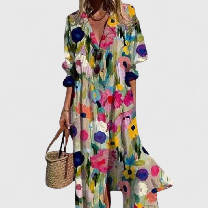 Cora women's boho maxi dress with vibrant floral print, v-neck, short sleeves, and flowing silhouette.