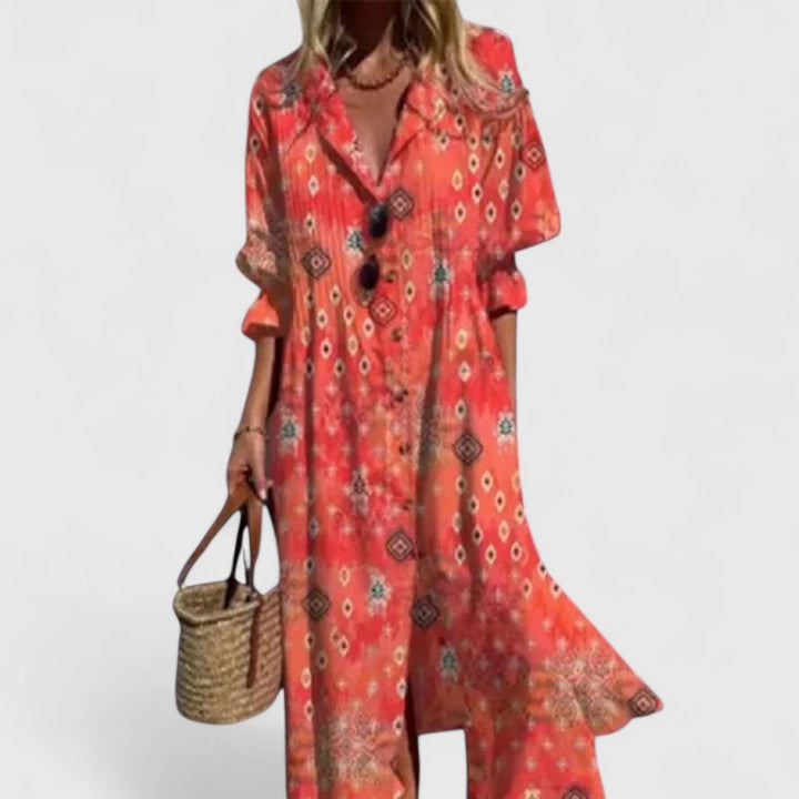Cora women's boho maxi dress in flowing red with striking geometric prints, short sleeves, and button-front.
