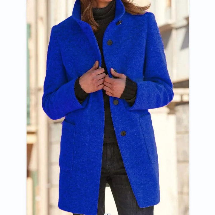 Vibrant blue longline wool-blend coat featuring a sophisticated funnel collar and button-front closure for winter warmth.