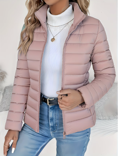 Dusty pink lightweight quilted puffer jacket with a high stand collar, full-length zip, and tailored fit.