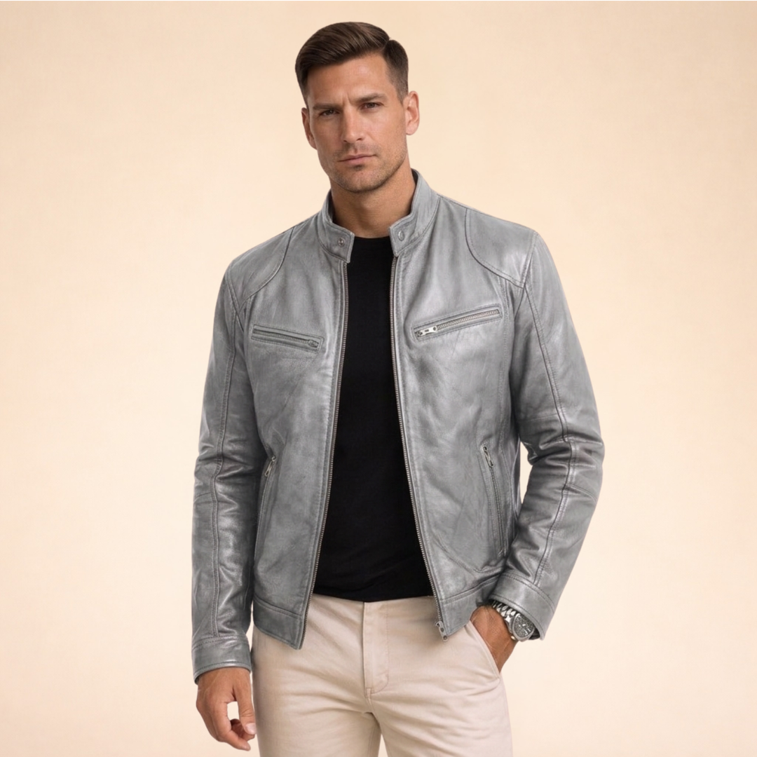 Slim fit grey faux leather moto jacket with a band collar, zip front, and chest pockets for a sharp, modern look.